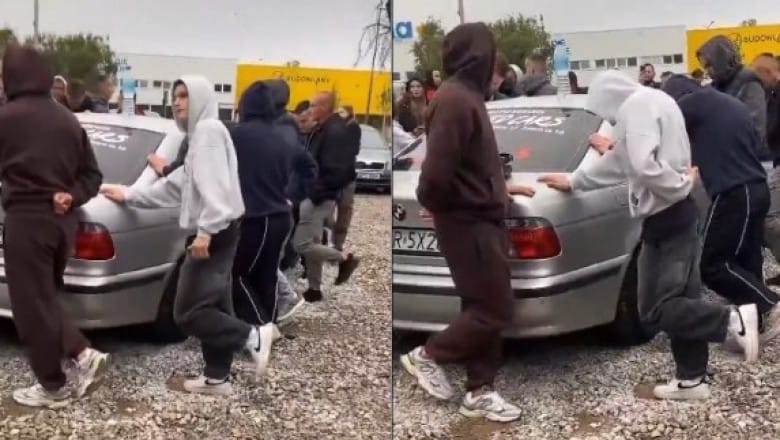Właściciel komisu zrobił konkurs. Trzeba stać na jednej nodze i trzymać BMW które jest do wygrania Zdjęcie główne wpisu